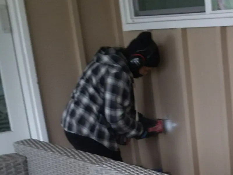 Professional electrician installing an exterior outlet in Rome